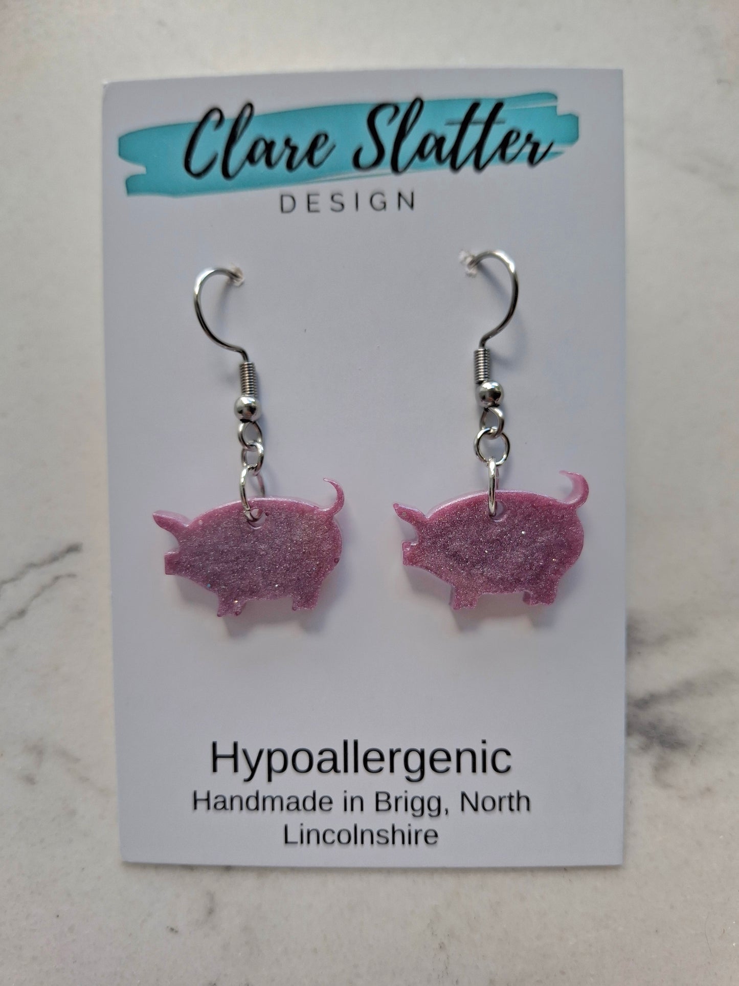 Pig dangles