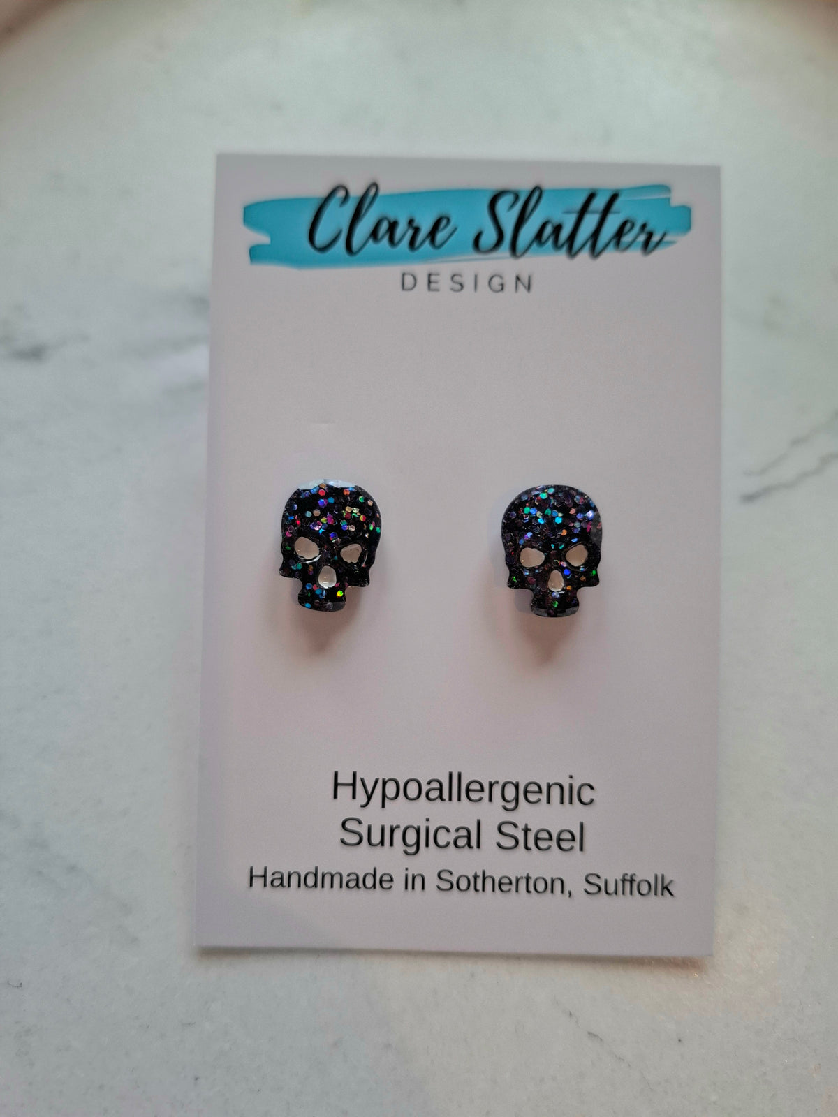 Faceted Black glitter skull studs