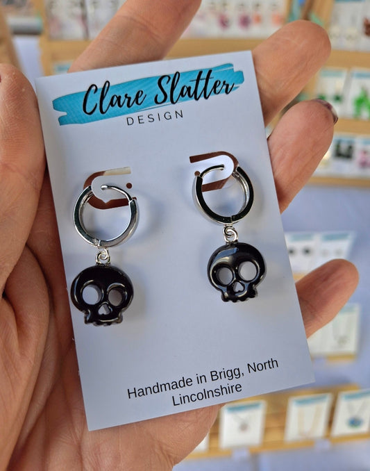 Black skull huggie hoops