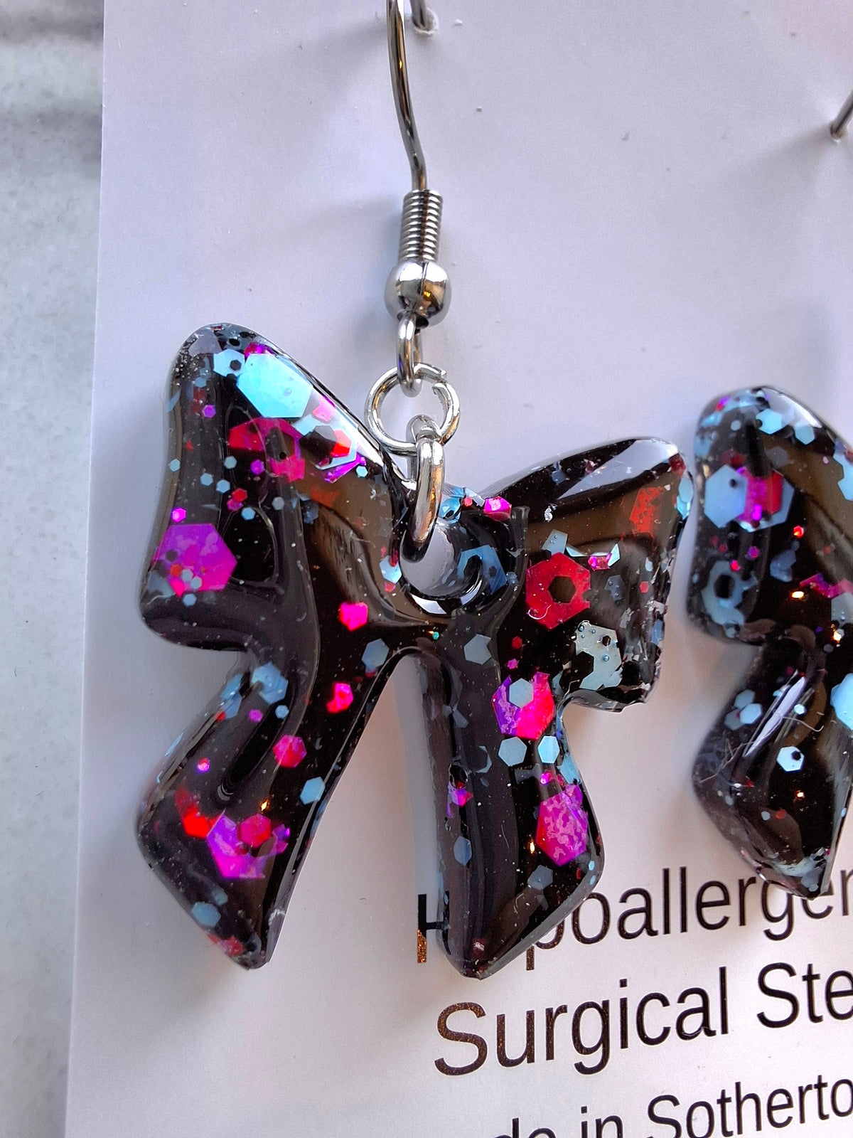 Black, blue and purple bow dangles